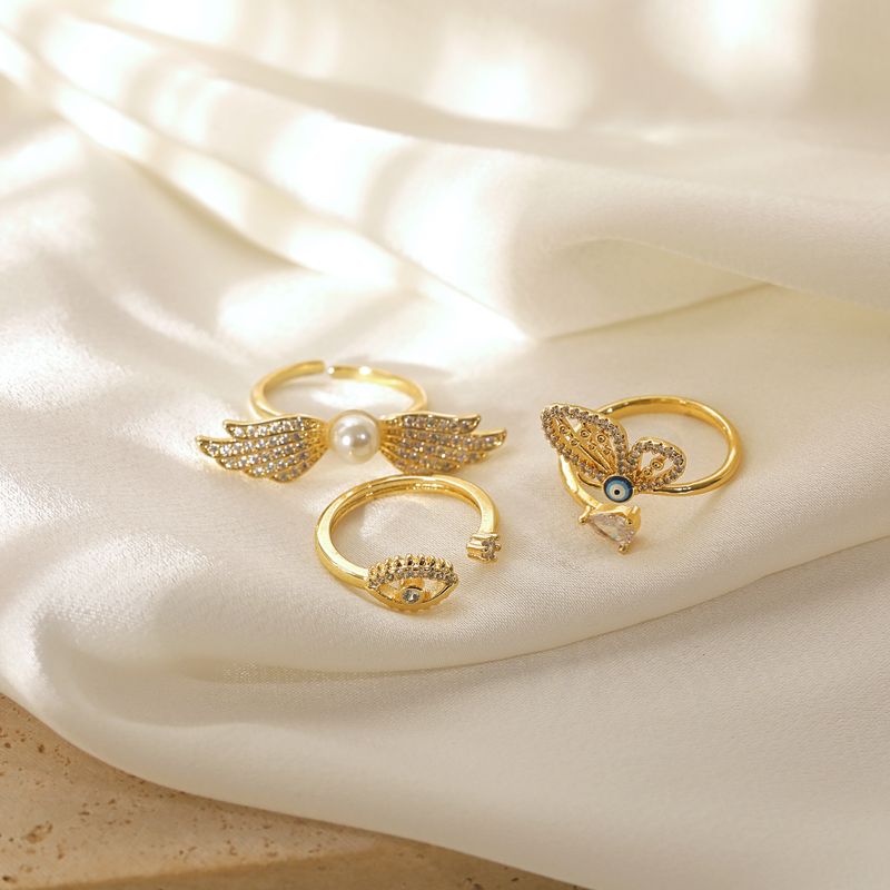 Copper 14K Gold Plated Elegant Lady Classic Style Inlay Devil's Eye Wings Butterfly Imitation Pearl Zircon Open Rings