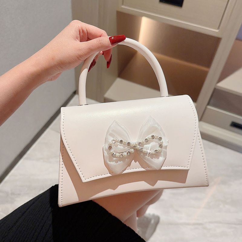 Women's Pu Leather Solid Color Elegant Bowknot Magnetic Buckle Evening Bag