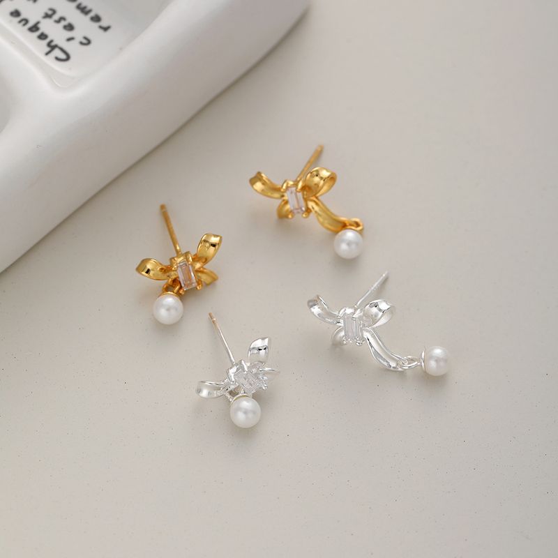 1 Pair Sweet Simple Style Bow Knot Hollow Out Inlay Sterling Silver Pearl Zircon Ear Studs