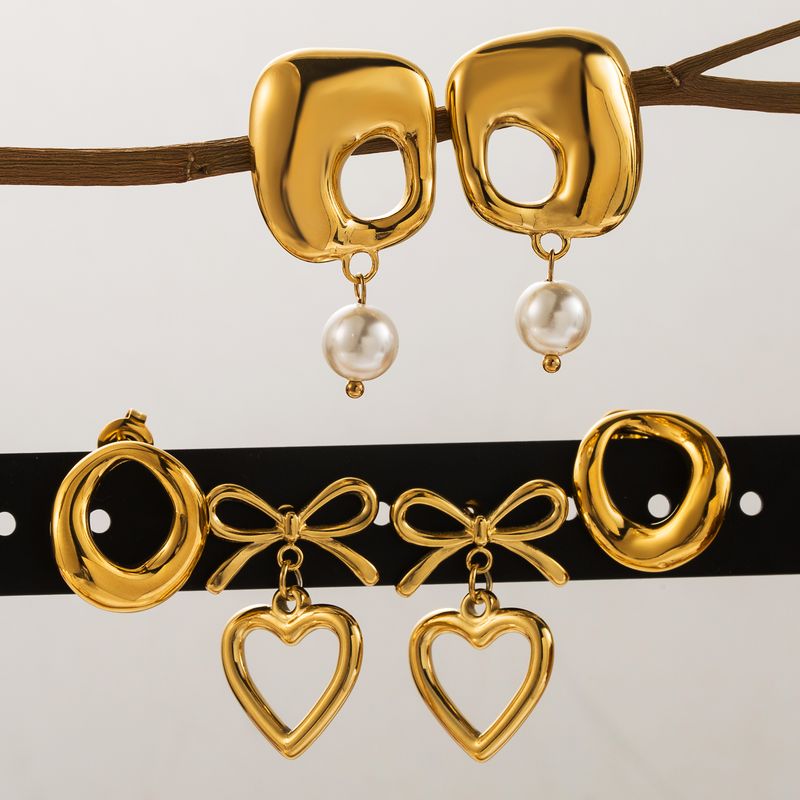 1 Par Estilo Vintage Estilo Clásico Geométrico Forma De Corazón Nudo De Lazo Perla Ahuecar Acero Inoxidable 304 Chapado En Oro De 14 Quilates. Pendientes De Gota