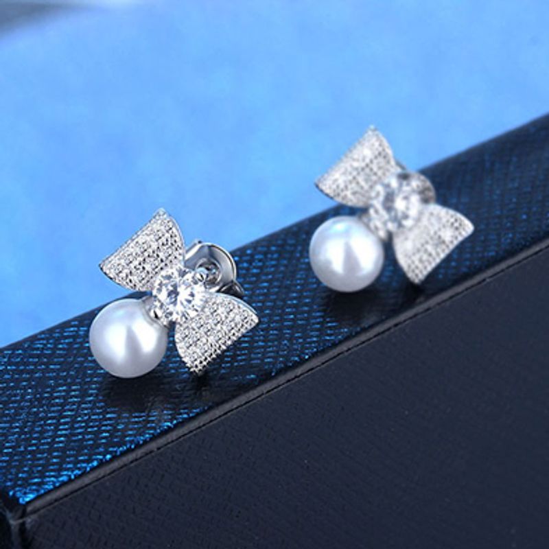 1 Paar Elegant Moderner Stil Pendeln Bogenknoten Inlay Kupfer Künstliche Perlen Zirkon Tropfenohrringe