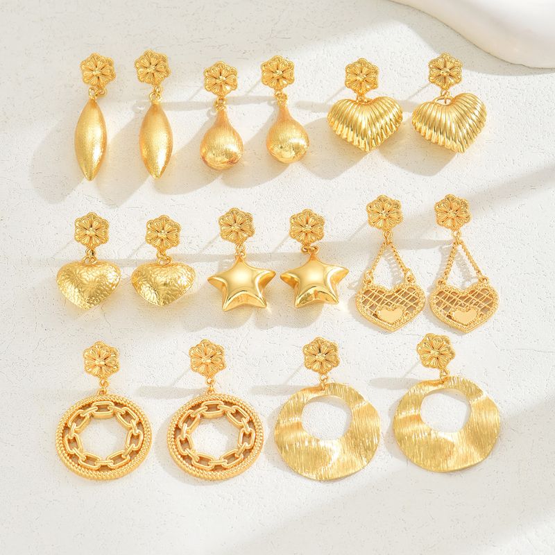 1 Pair Ethnic Style Shiny Star Heart Shape Flower Hollow Out Copper Zinc Alloy 18K Gold Plated Drop Earrings