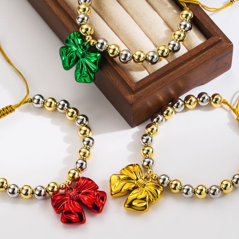 Großhandel Einfacher Stil Pendeln Runden Bogenknoten Kupfer Perlen 18 Karat Vergoldet Armbänder