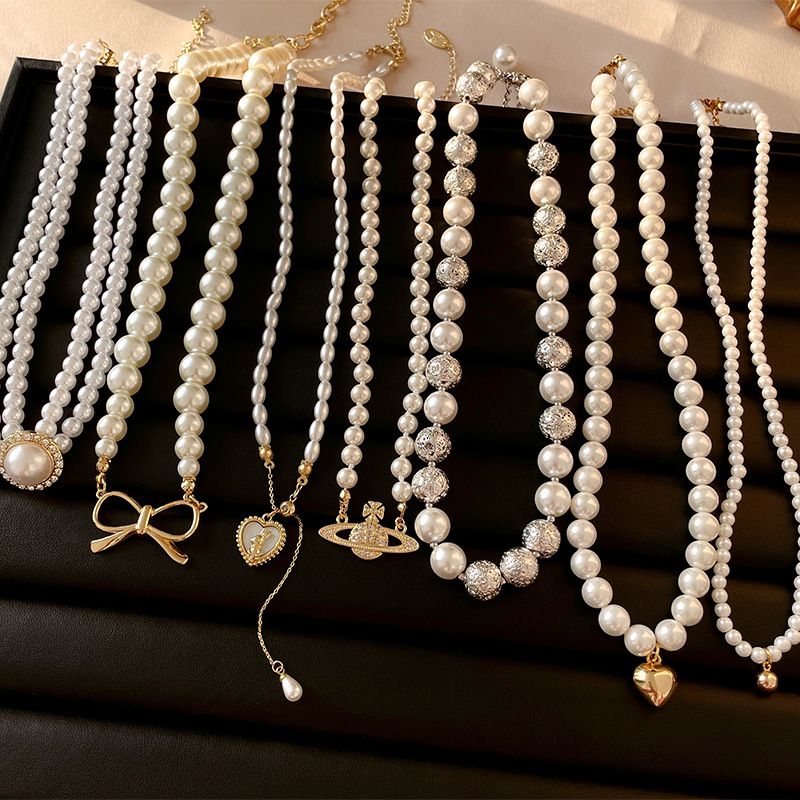 Glam Retro Heart Shape Bow Knot Imitation Pearl Beaded Plating Inlay Rhinestones Women's Layered Necklaces