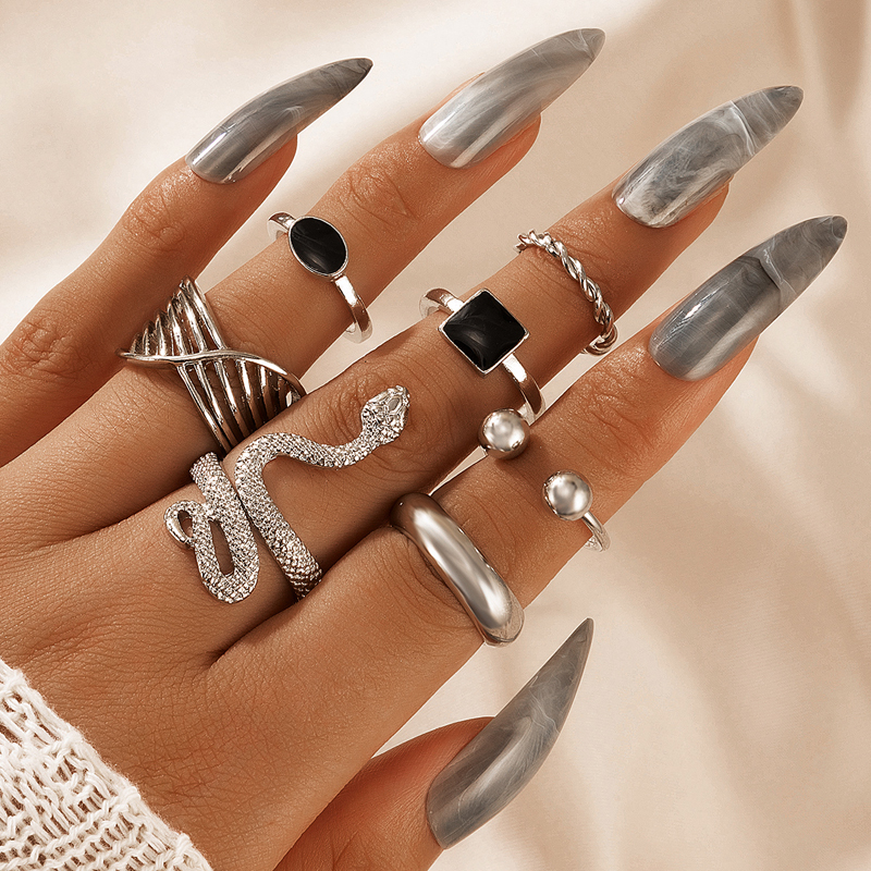 New Jewelry Simple Snake-shaped Retro Ethnic Style Black Drip Oil Zodiac Twist Ring Seven-piece Set display picture 2