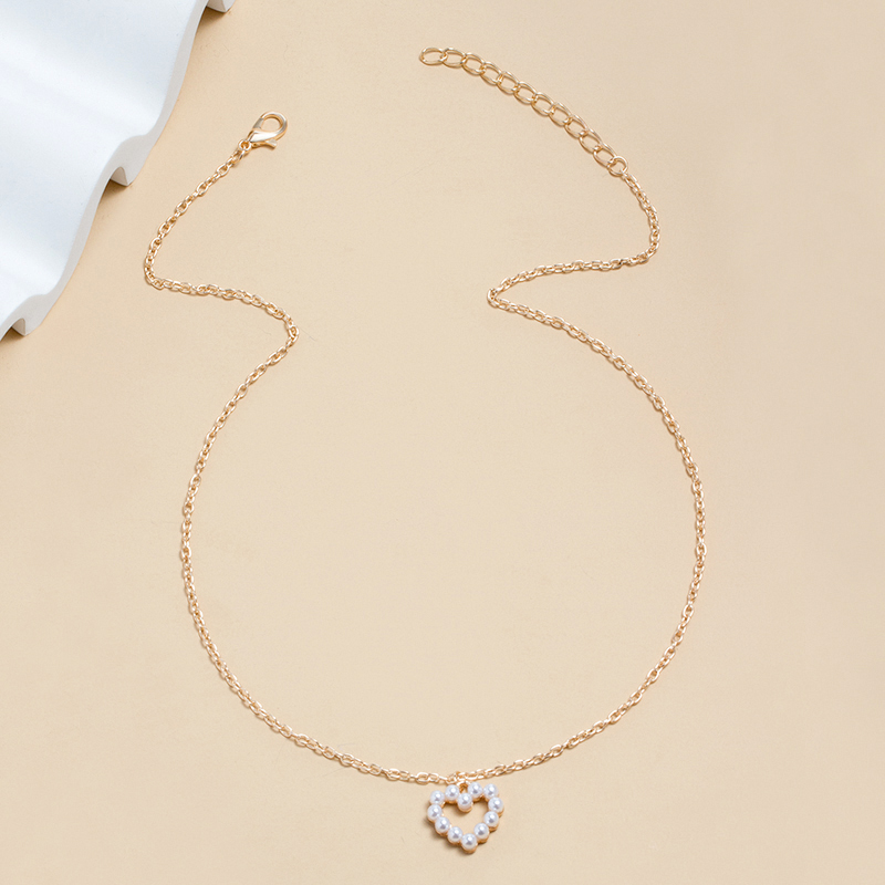 Einfacher Stil Herz Metall Künstliche Perlen Frau Halskette Mit Anhänger display picture 2