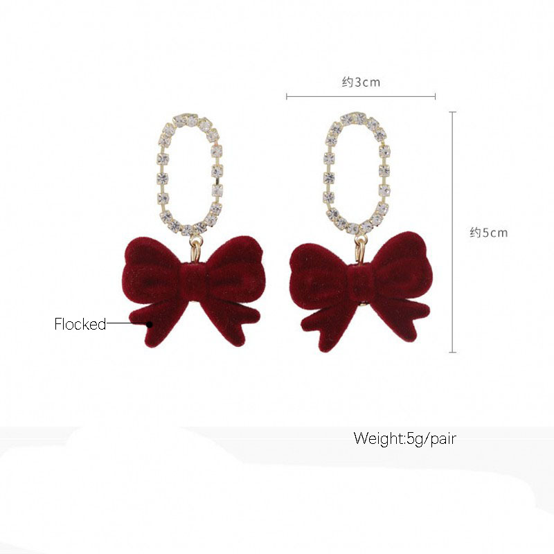 Full Diamond Super Flash Flocking Bow Earrings Wholesale display picture 1