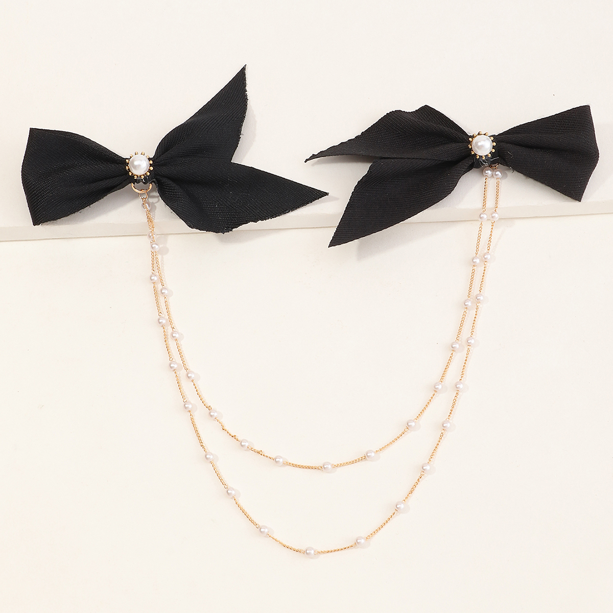 Fashion Korean New Style Simple Bowknot Double Chain Pearl Word Clip display picture 1