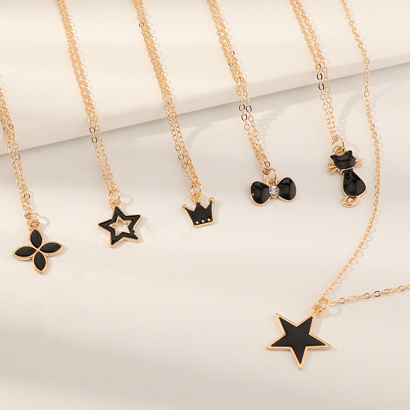 Simple Black Dripping Flower Five-pointed Star Crown Cat Pendant Necklace Set display picture 2