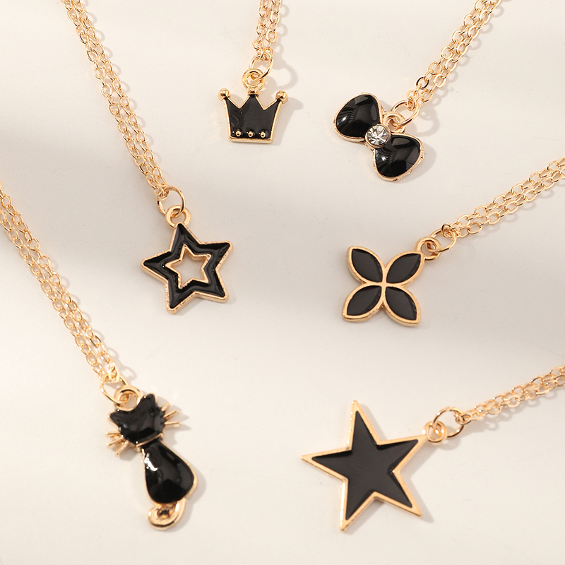 Simple Black Dripping Flower Five-pointed Star Crown Cat Pendant Necklace Set display picture 3