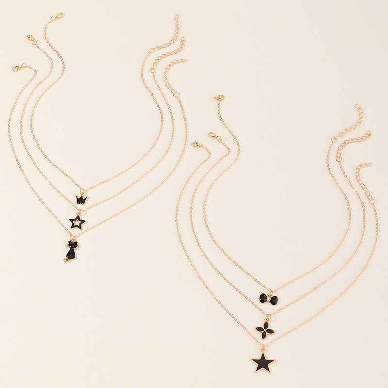 Simple Black Dripping Flower Five-pointed Star Crown Cat Pendant Necklace Set display picture 5