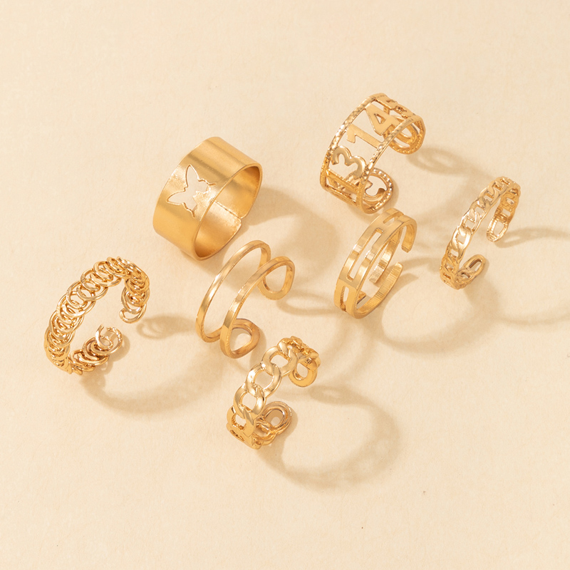 Großhandel Schmuck Mode Goldener Hohler Twist Geometrischer Ring 7-teiliges Set Nihaojewelry display picture 1