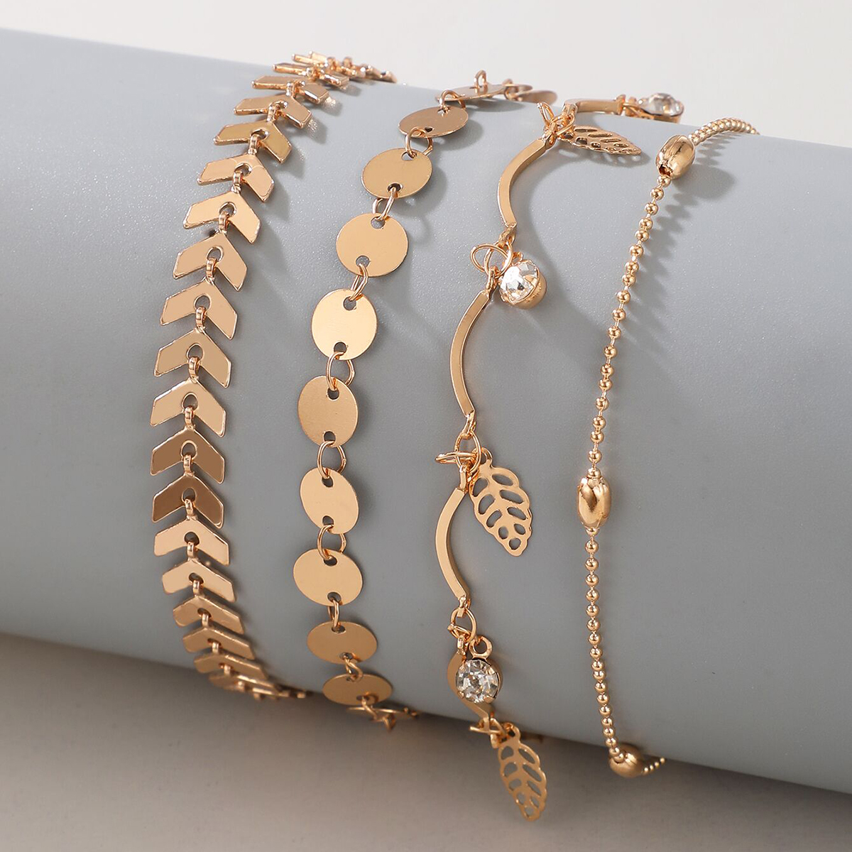 Wholesale Jewelry Simple Triangle Arrow Disc Hollow Leaf Anklet 4-piece Set Nihaojewelry display picture 3