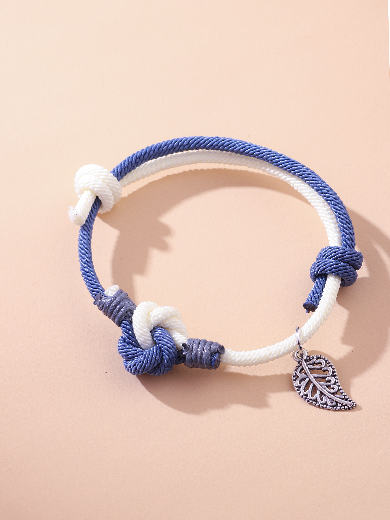 Retro Knot Braided Hand Rope Hollow Leaves Simple Contrast Color Bracelet display picture 1