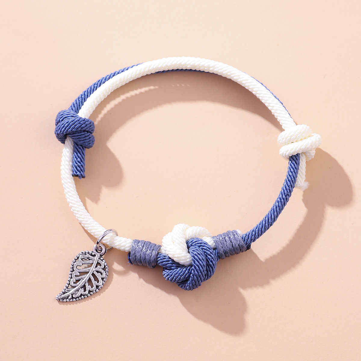 Retro Knot Braided Hand Rope Hollow Leaves Simple Contrast Color Bracelet display picture 2