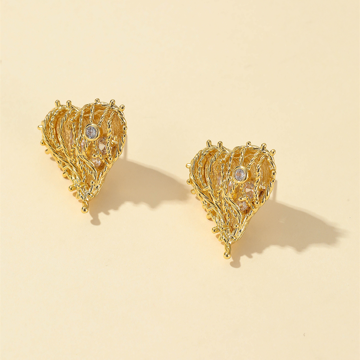 Fashionable Three-dimensional Woven Heart-shaped Stud Earrings Copper display picture 3