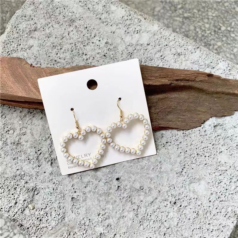 Ins Style Cute Exaggerated Star Heart Alloy Stoving Varnish Plating Inlaid Pearls No Inlaid Women's Earrings display picture 1