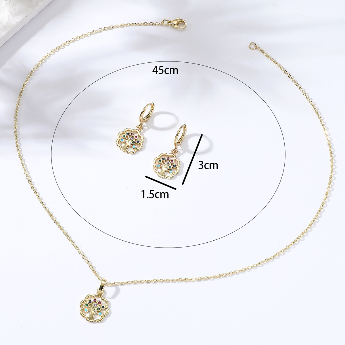 Fashion Simple Cute Inlaid Zircon Copper-plated Gold Color Hollow Peace Tree Necklace Earrings Set display picture 3