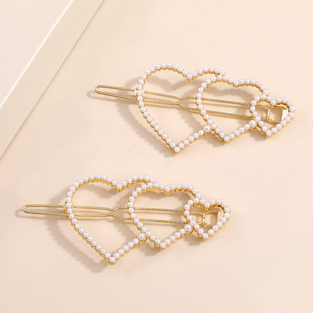 2022 New Fashion Elegant Pearl Inlaid Heart-shaped Bang Side Hairpin display picture 2