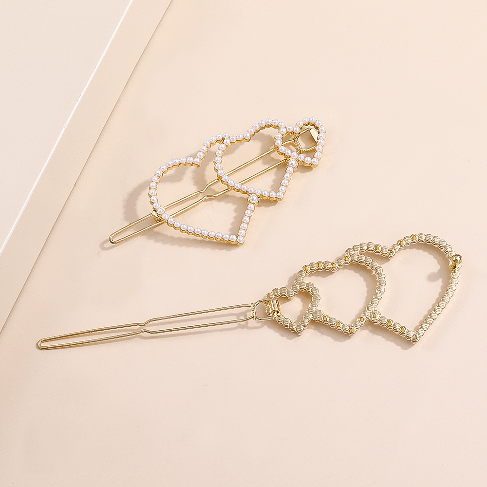 2022 New Fashion Elegant Pearl Inlaid Heart-shaped Bang Side Hairpin display picture 3