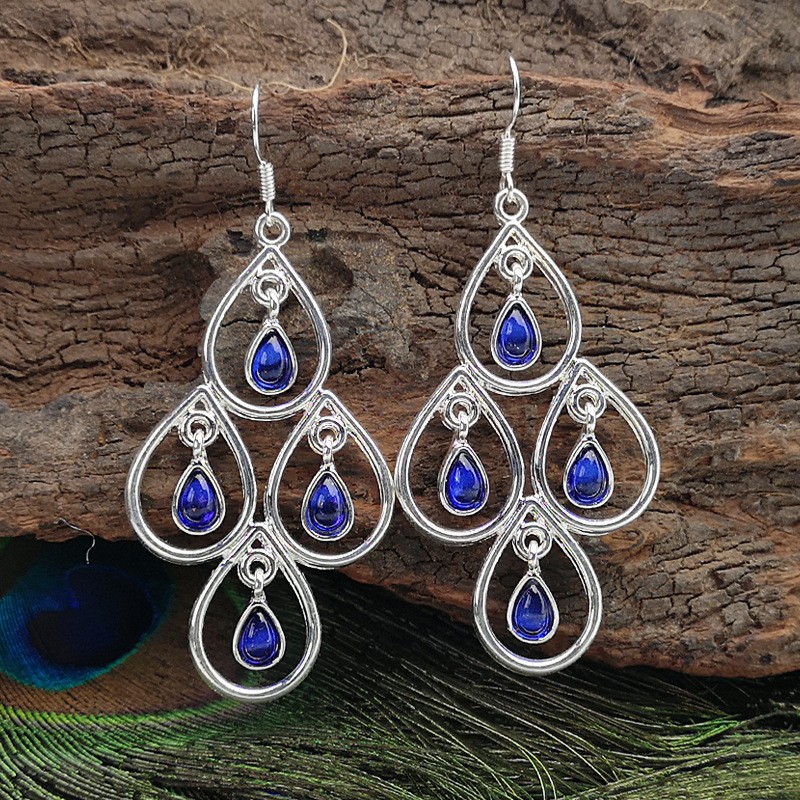 Creative Peacock Blue Moonstone Drop-shaped Hollow Pendant Earrings display picture 1