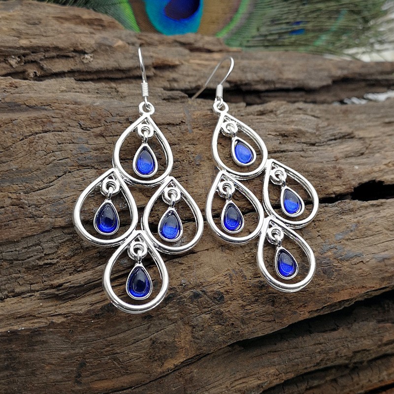 Creative Peacock Blue Moonstone Drop-shaped Hollow Pendant Earrings display picture 2