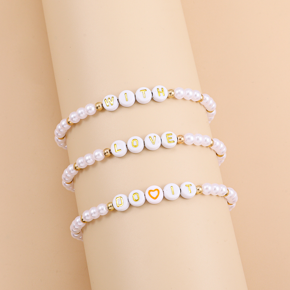 Fashion Bohemian Woven Imitation Pearl Retro Stitching Letter Love Chain Bracelet display picture 1