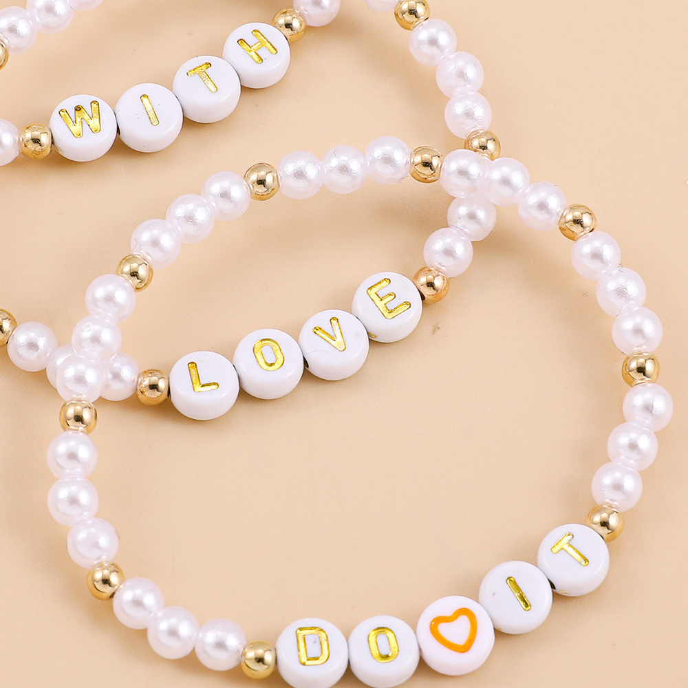Fashion Bohemian Woven Imitation Pearl Retro Stitching Letter Love Chain Bracelet display picture 3