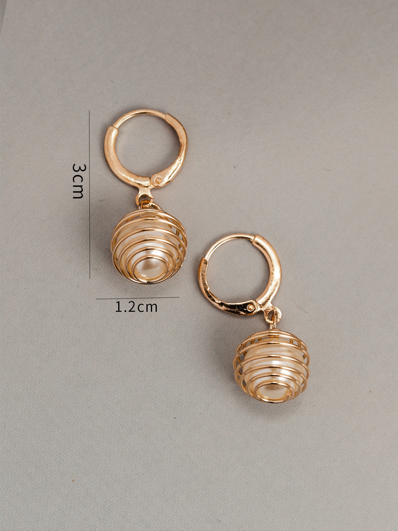 Korean Fashion Simple Round Hollow Earrings Stainless Steel Pearl Earrings Peach Pit-shaped Earclip Earrings display picture 4