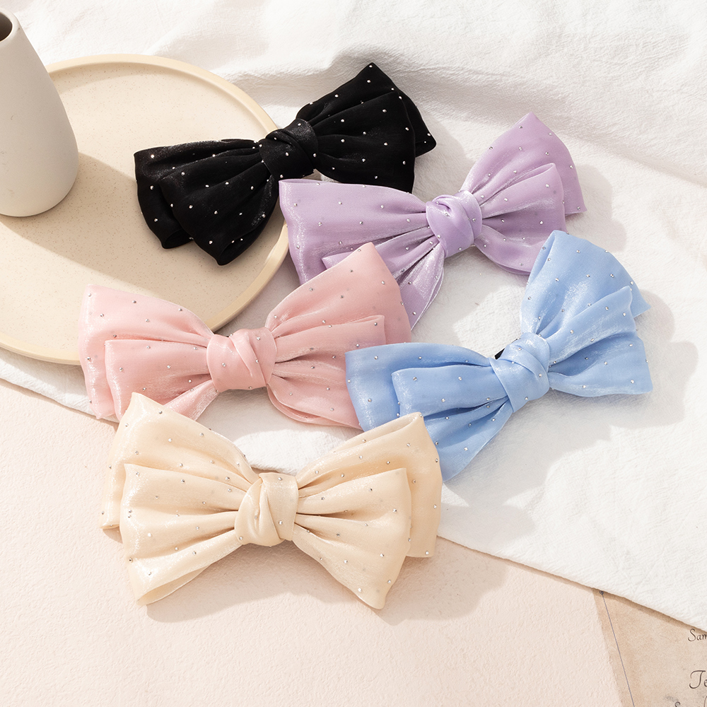 Simple Style Solid Color Headwear Inlaid Rhinestone Bow Shape Hairpin display picture 1