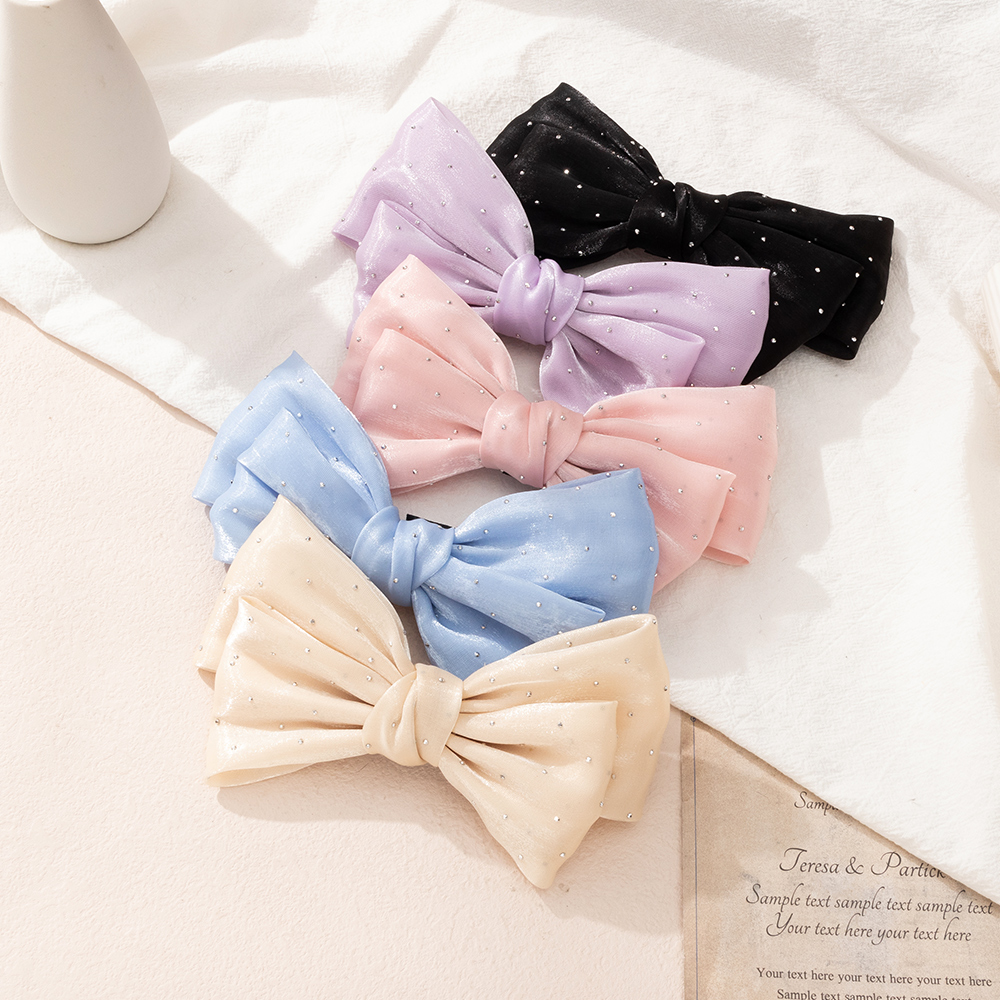 Simple Style Solid Color Headwear Inlaid Rhinestone Bow Shape Hairpin display picture 3