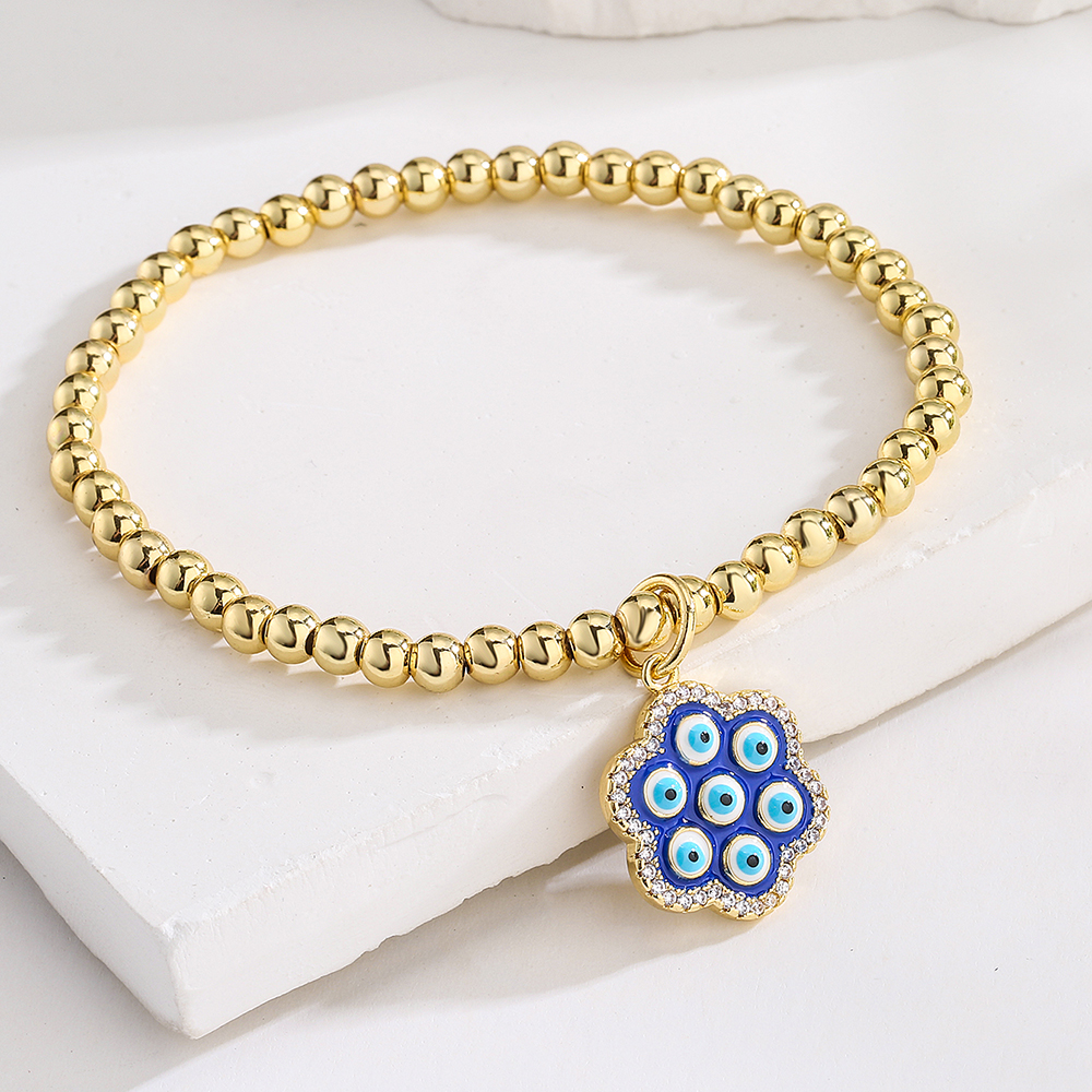 New Style Copper Plated 18k Gold Zirconia Oil Drop Blue Eye Flower Bracelet display picture 2