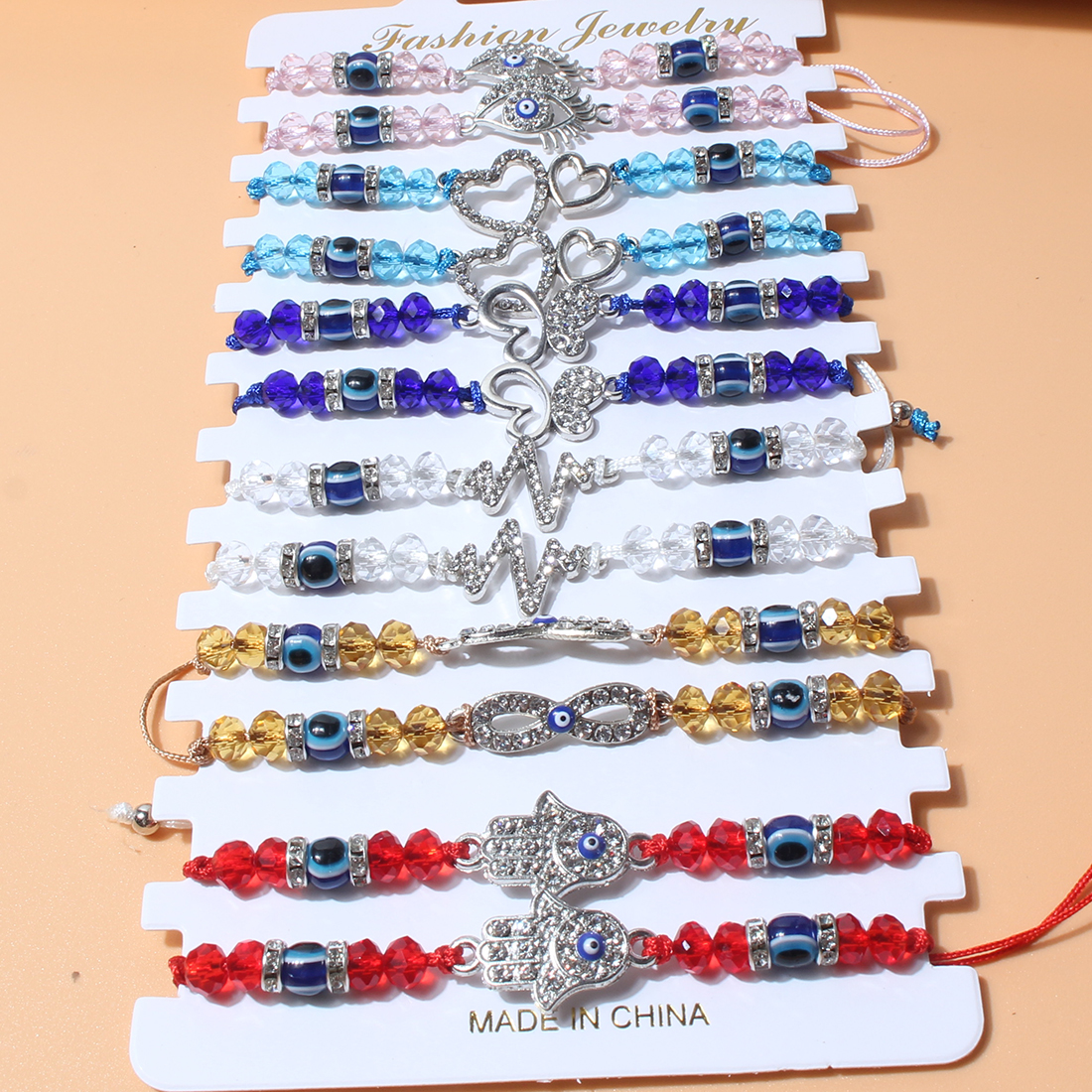 Fashion Bohemian Style Woven Crystal String Beads Devil's Eye Drop Oil Palm Alloy Bracelet display picture 4