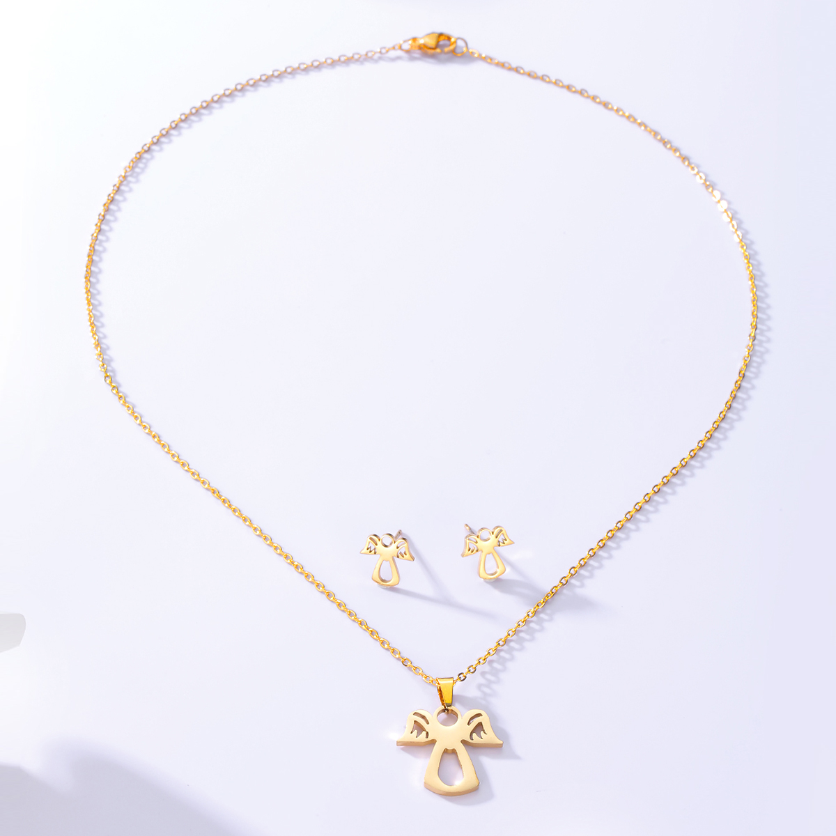 Einfache Mode Überzogene Engel Gold Edelstahl Halskette Ohrringe Set display picture 2