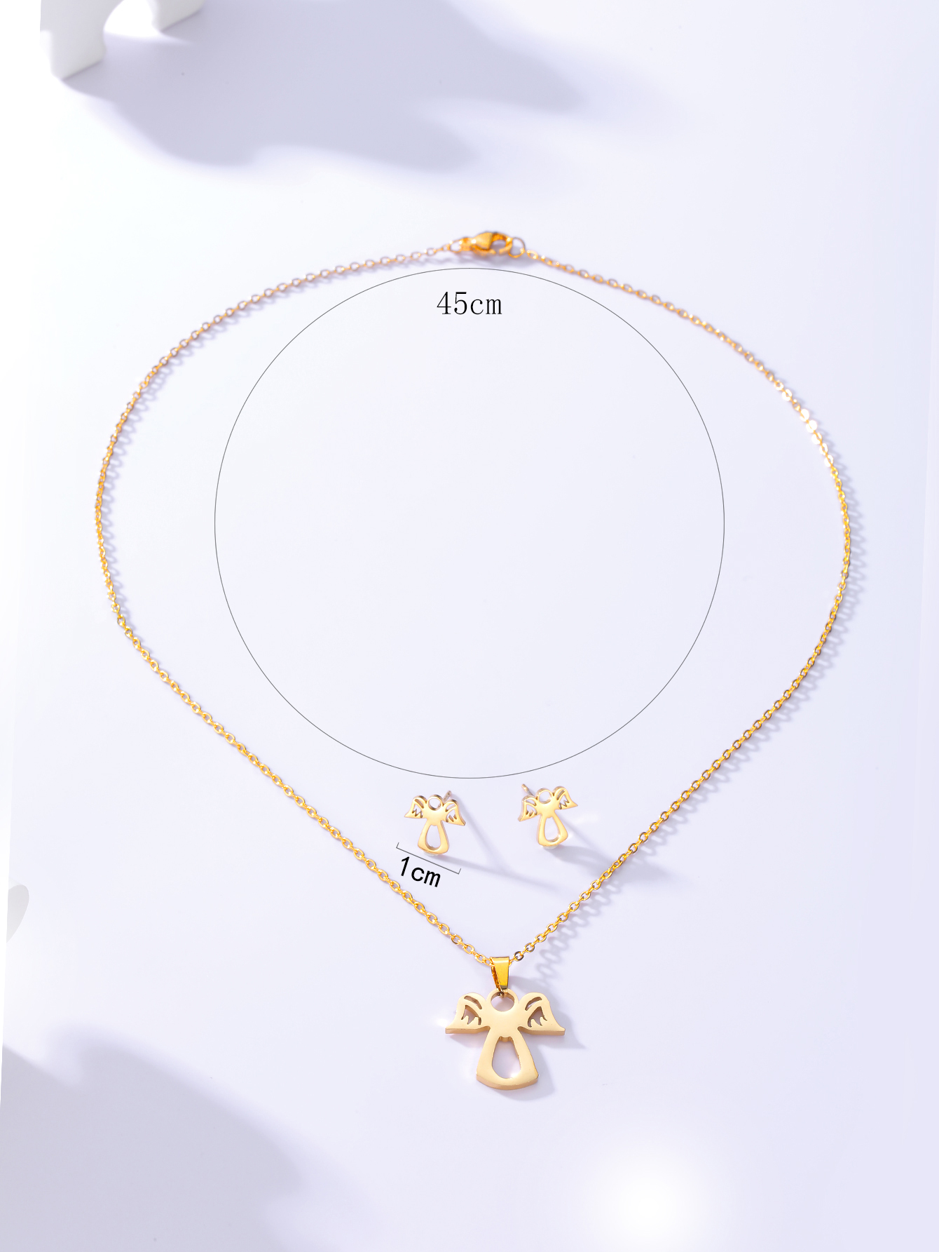 Einfache Mode Überzogene Engel Gold Edelstahl Halskette Ohrringe Set display picture 3