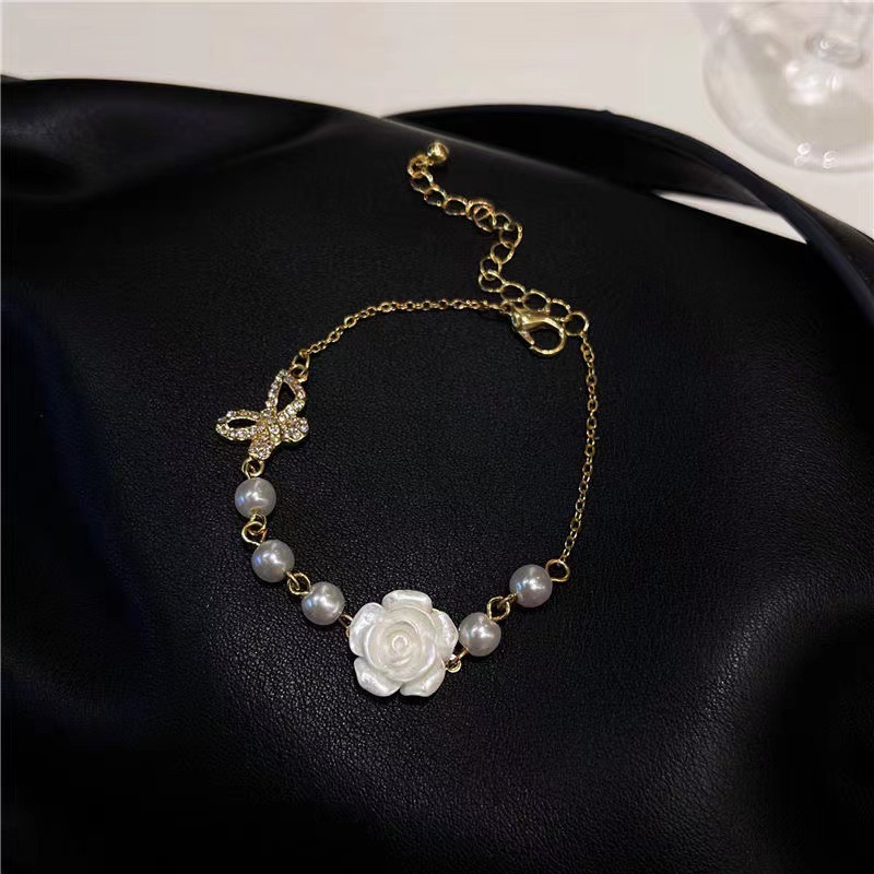 Fashion New Style Hollow Butterfly Inlaid Rhinestone Camellia Flower Pearl Bracelet display picture 4