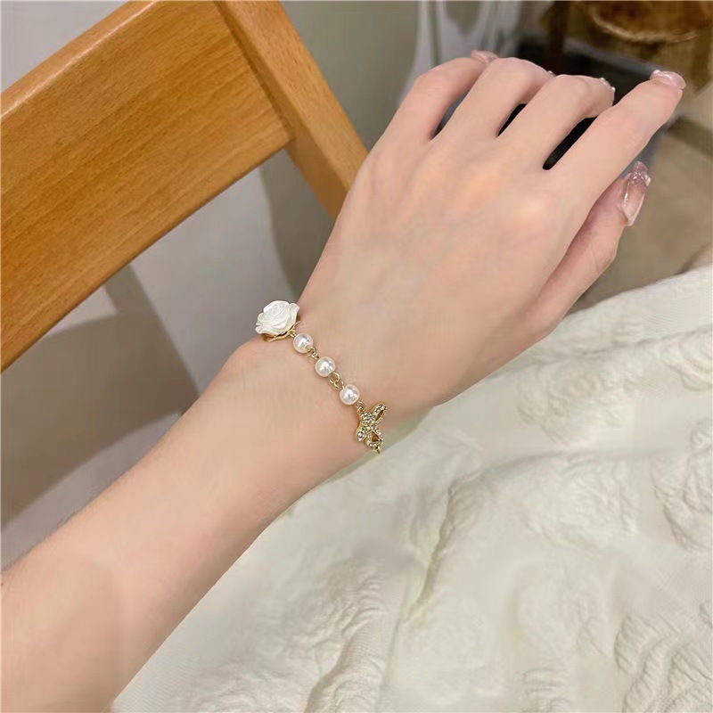 Fashion New Style Hollow Butterfly Inlaid Rhinestone Camellia Flower Pearl Bracelet display picture 5
