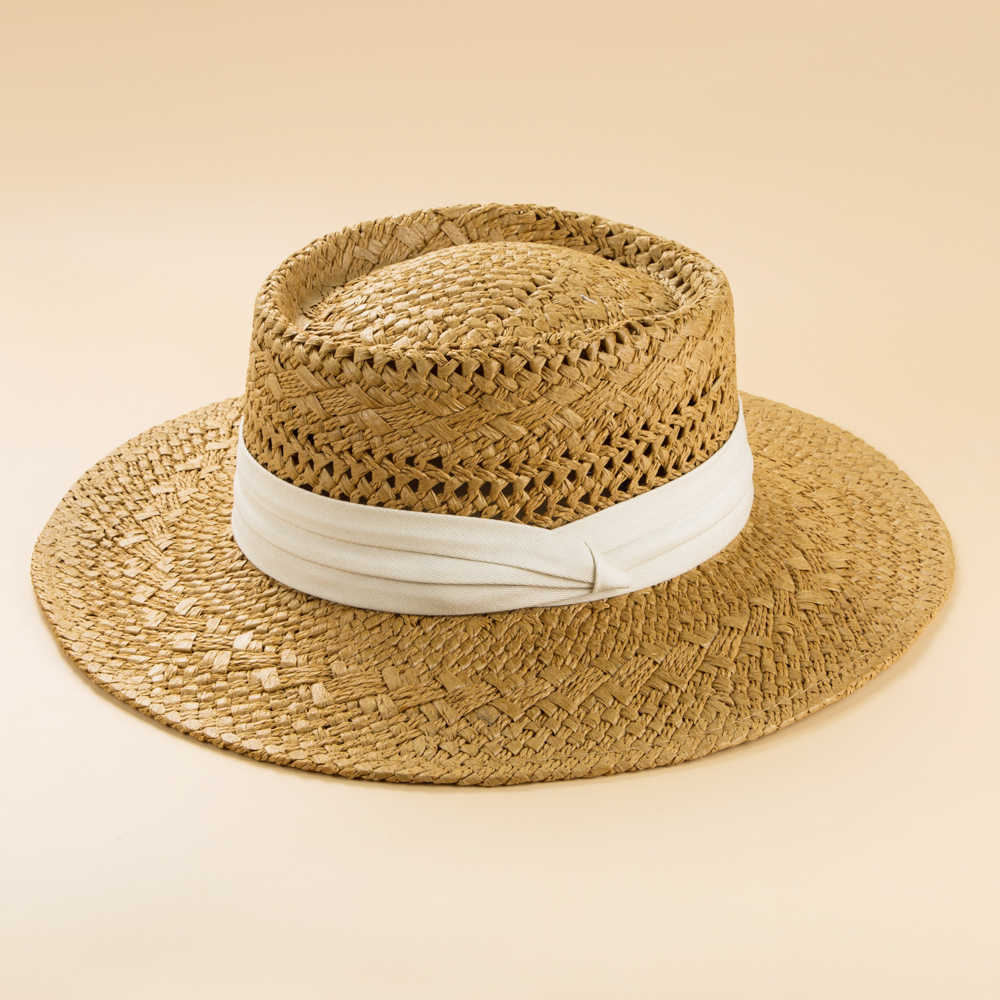 Fashion British Style Handmade Straw Woven Concave Top Hat Female Summer Vacation Seaside Sun-proof Beach Hat display picture 4