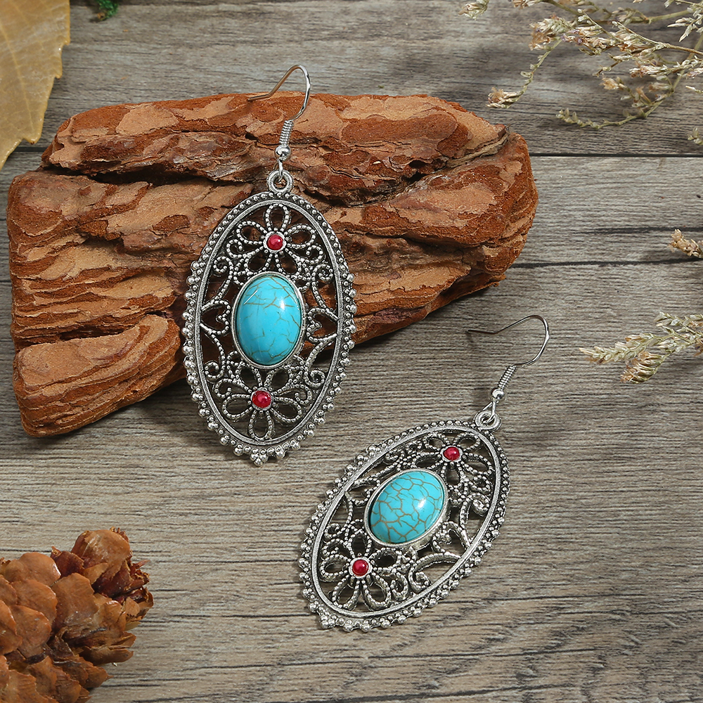 Vintage Style Oval Flower Alloy Hollow Out Turquoise Earrings display picture 1