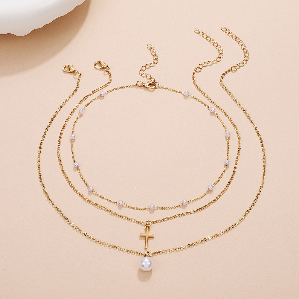 Retro Cross Palm Butterfly Alloy Inlay Artificial Pearls Rhinestones 14k Gold Plated Women's Layered Necklaces display picture 10