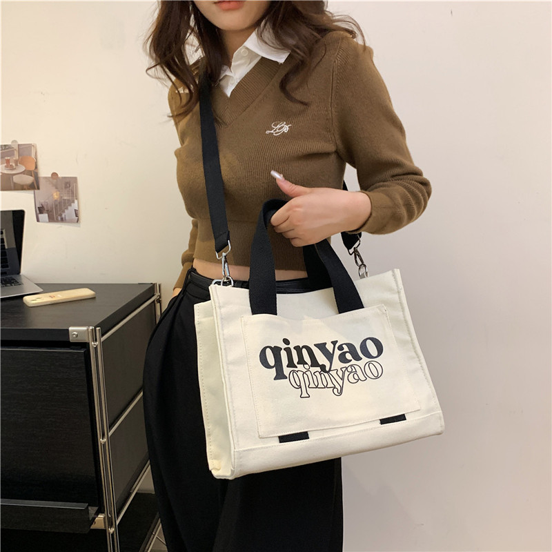 Women's All Seasons Canvas Letter Solid Color Preppy Style Classic Style Sewing Thread Square Hidden Buckle Shoulder Bag Canvas Bag Handbag display picture 1