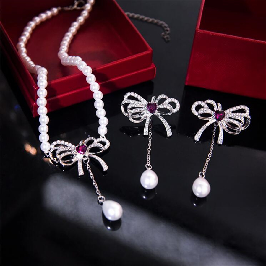 Elegant Bow Knot Imitation Pearl Alloy Inlay Rhinestones Women's Earrings Necklace display picture 1