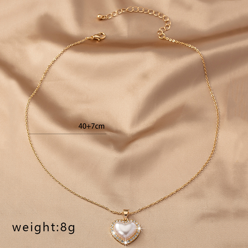 Dulce Estilo Coreano Electrocardiograma Forma De Corazón Alas Diamantes De Imitación Perla Aleación Venta Al Por Mayor Collar Colgante display picture 3