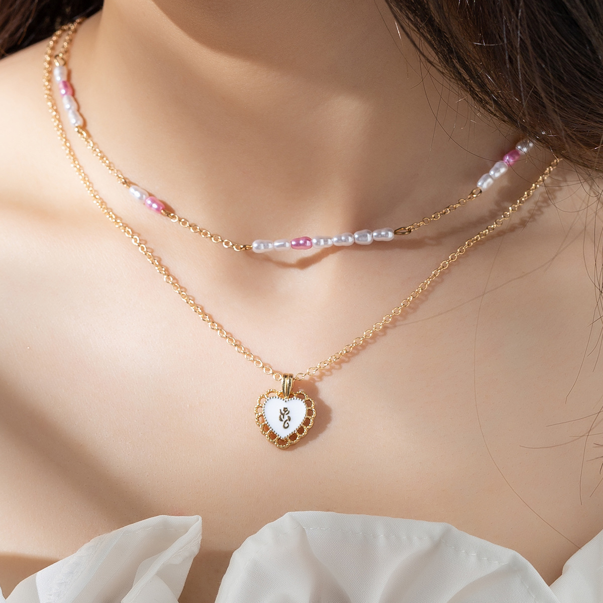 Elegant Heart Shape Alloy Plastic Women's Layered Necklaces display picture 1