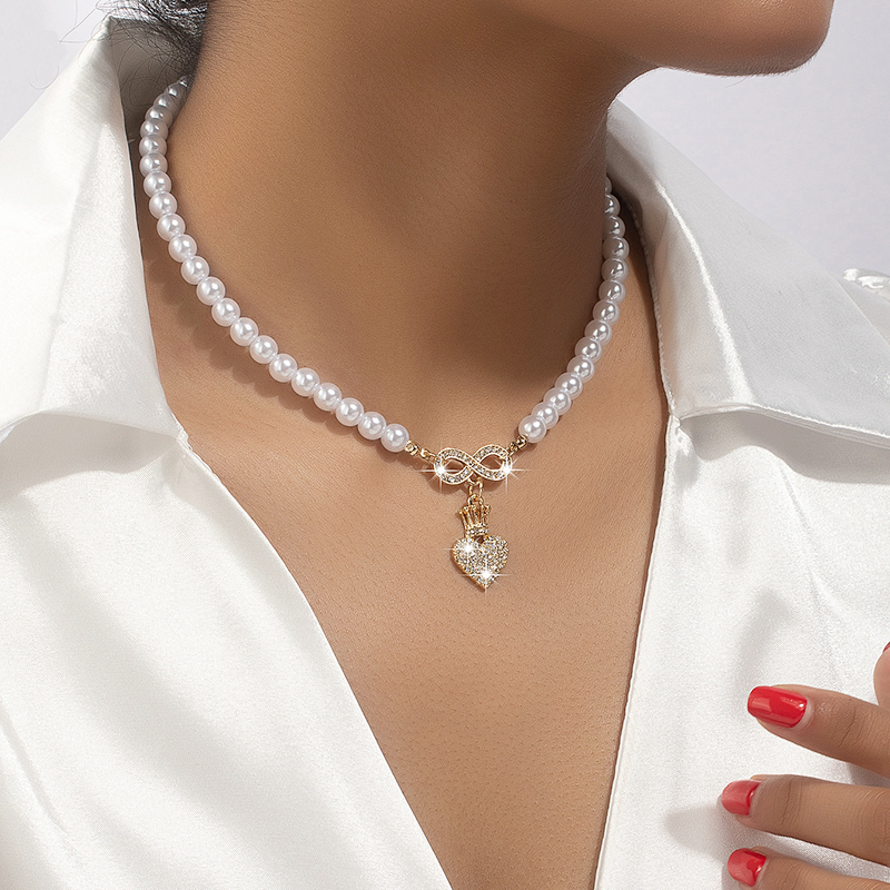 Elegante Dulce Forma De Corazón Aleación Enchapado Embutido Diamantes De Imitación Perla Mujeres Collar Colgante display picture 1