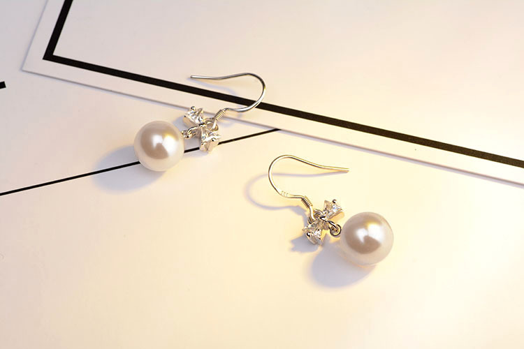 1 Pair Elegant Bow Knot Plating Inlay Copper Artificial Pearls Zircon White Gold Plated Drop Earrings display picture 4