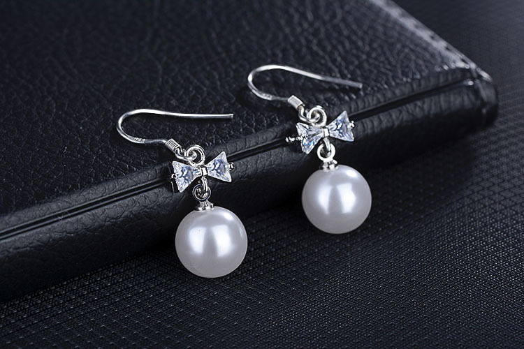 1 Pair Elegant Bow Knot Plating Inlay Copper Artificial Pearls Zircon White Gold Plated Drop Earrings display picture 7