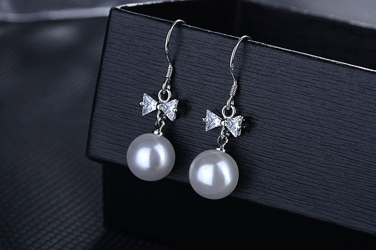 1 Pair Elegant Bow Knot Plating Inlay Copper Artificial Pearls Zircon White Gold Plated Drop Earrings display picture 8