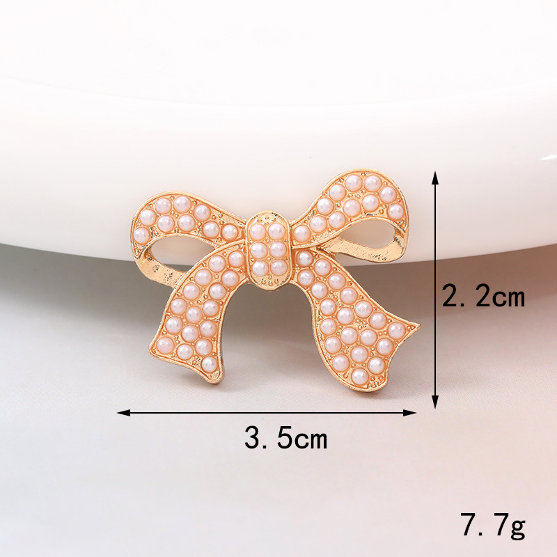 Sweet Bow Knot Metal Plating Inlay Artificial Pearls Artificial Diamond Jewelry Accessories display picture 7