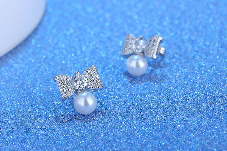 1 Paar Elegant Moderner Stil Pendeln Bogenknoten Inlay Kupfer Künstliche Perlen Zirkon Tropfenohrringe display picture 1